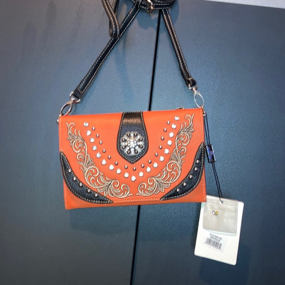 American Bling western crossbody swirl studded orange and black flip closure